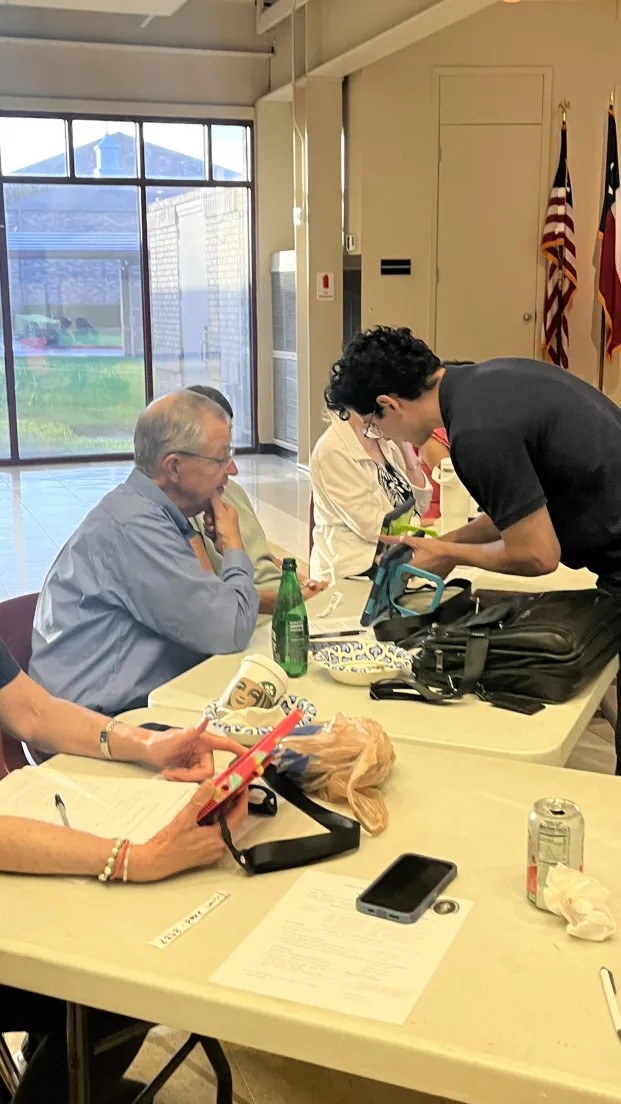 MMDM board and station leads gathered around the table during the June 30 demo